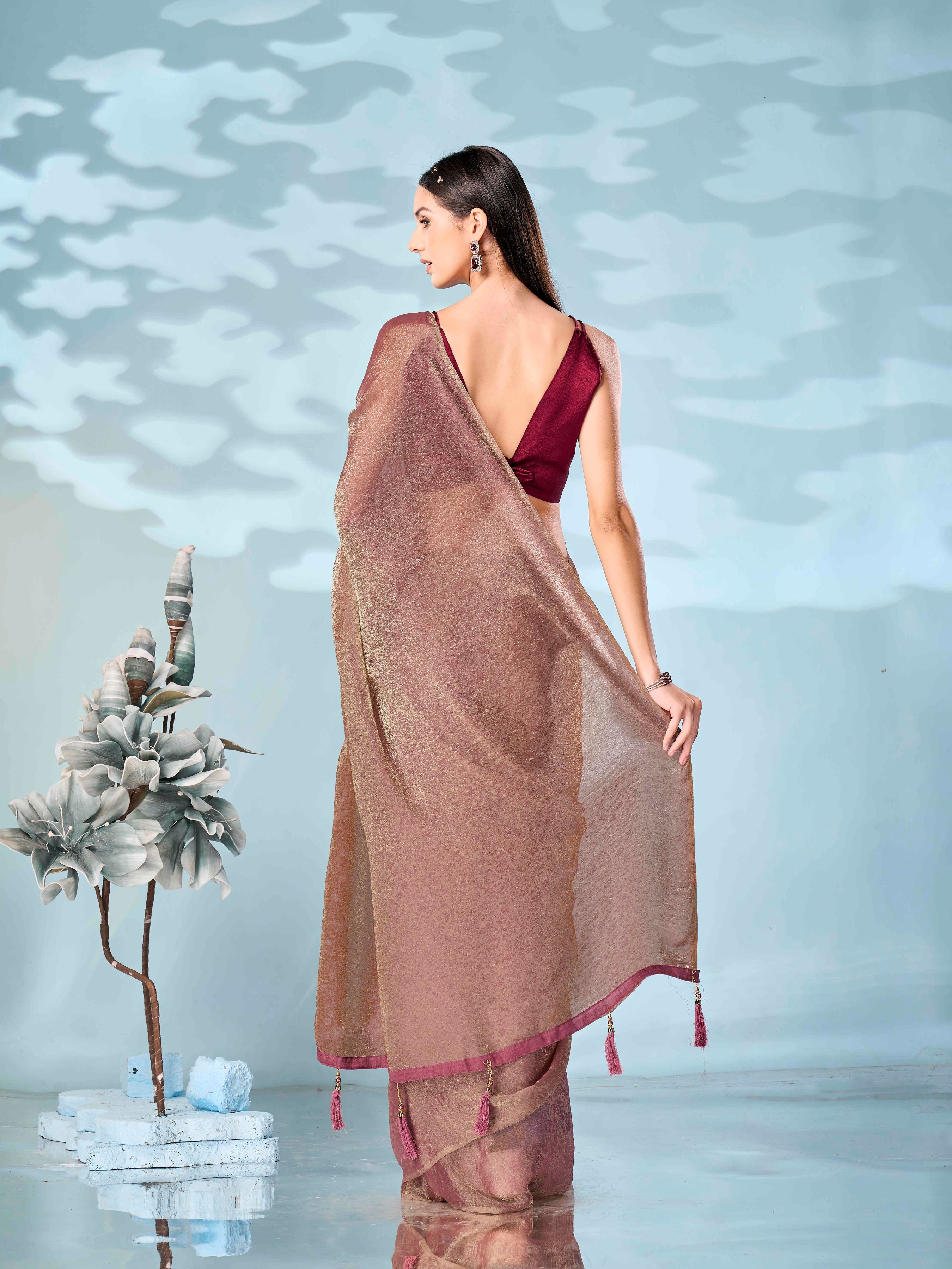 Two tone rose gold and dusty pink colored woven saree with tassles on pallu